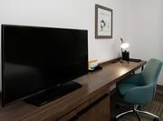 Guestroom With Work Desk and TV
