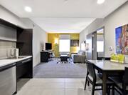 Guestroom Studio with Kitchen, Lounge Area, Sofa, Footrest, Work Desk and HDTV