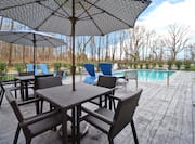 Outdoor Patio Area and View of Swimming Pool