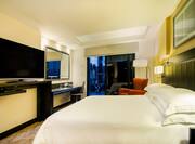 HDTV Desk and Chair in Suite with Large Bed and Terrace
