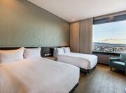 Guest Room with Two Double Beds and City View