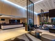 DoubleTree Hotel Reception Desk and Lobby Seating Area with HDTV