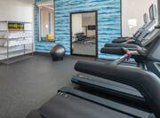 on-site fitness center, treadmills, ellipticals, free weights