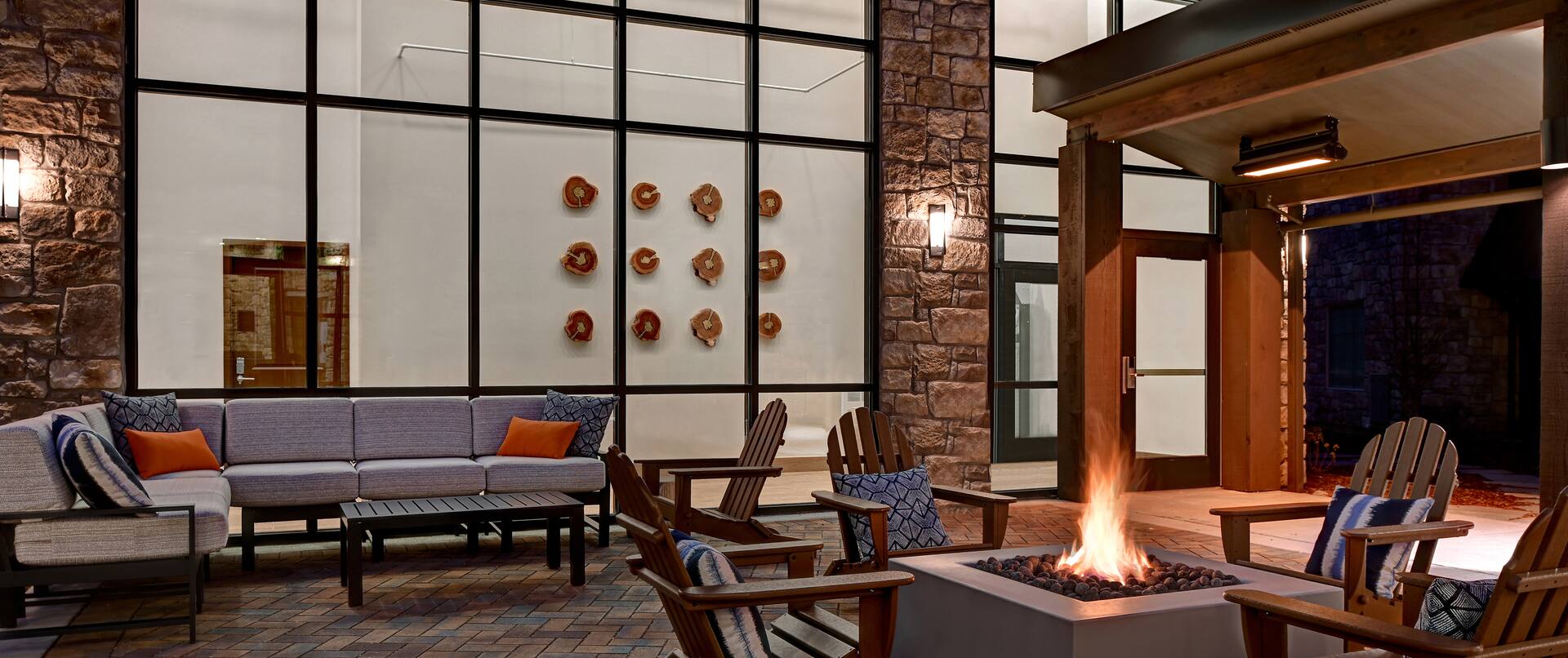 exterior patio with seating and fire pit