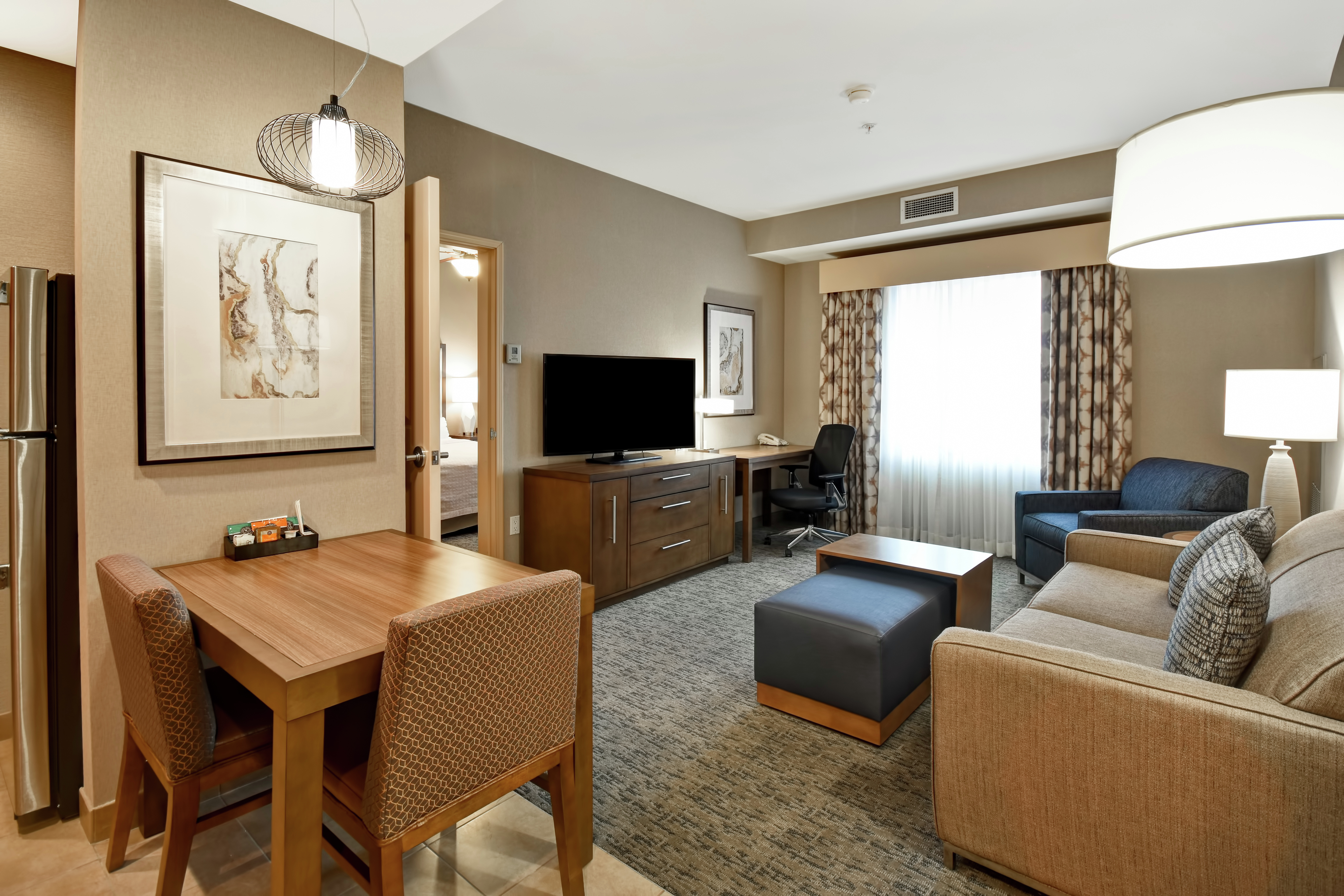 Suite Living Area with TV, Work Desk, and Dining Table