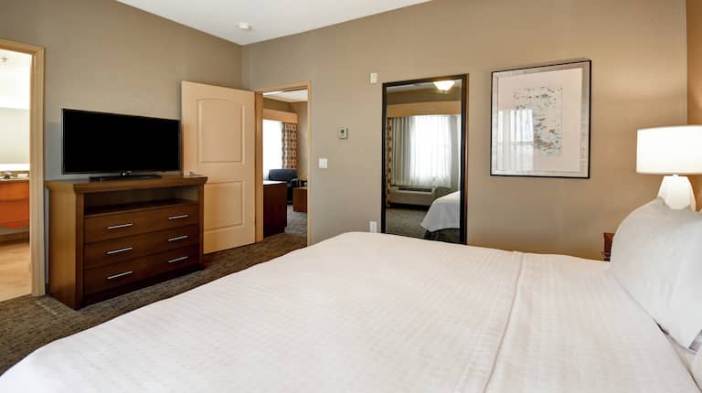 Suite Bedroom with King Bed and TV