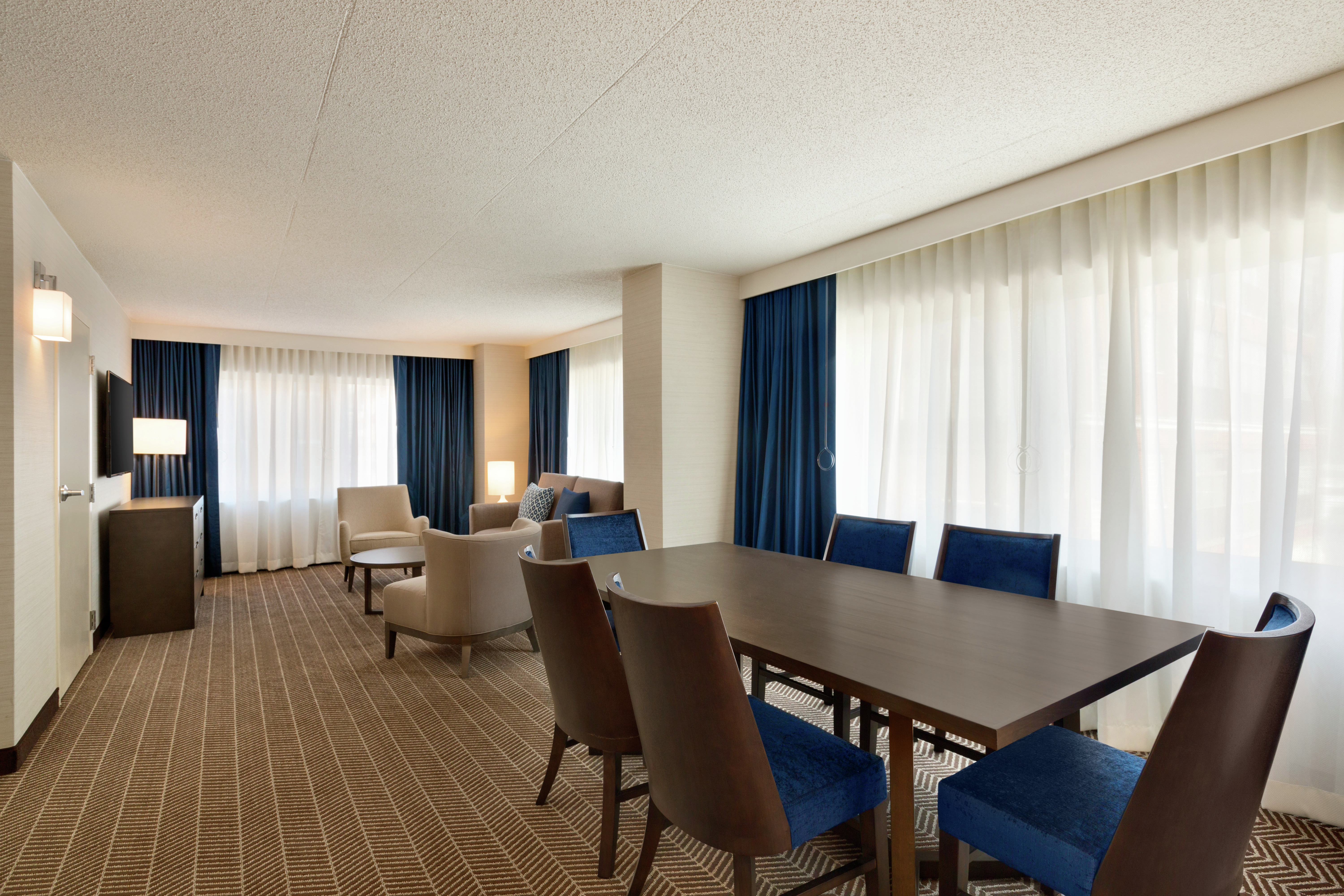 Executive Suite Living Area with Meeting Table and Chairs