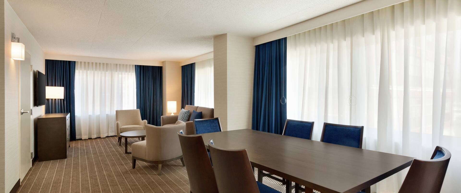 Executive Suite Living Area with Meeting Table and Chairs