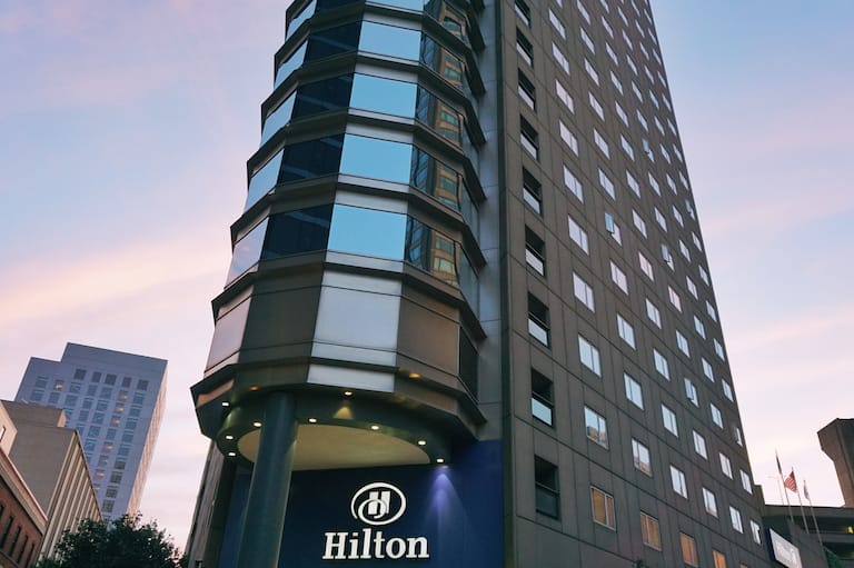 Hotel exterior, Hilton sign, looking up