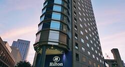 Hotel exterior, Hilton sign, looking up