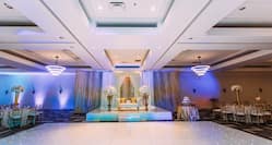 Wedding ballroom dance floor and view of bride & groom lounge sofa