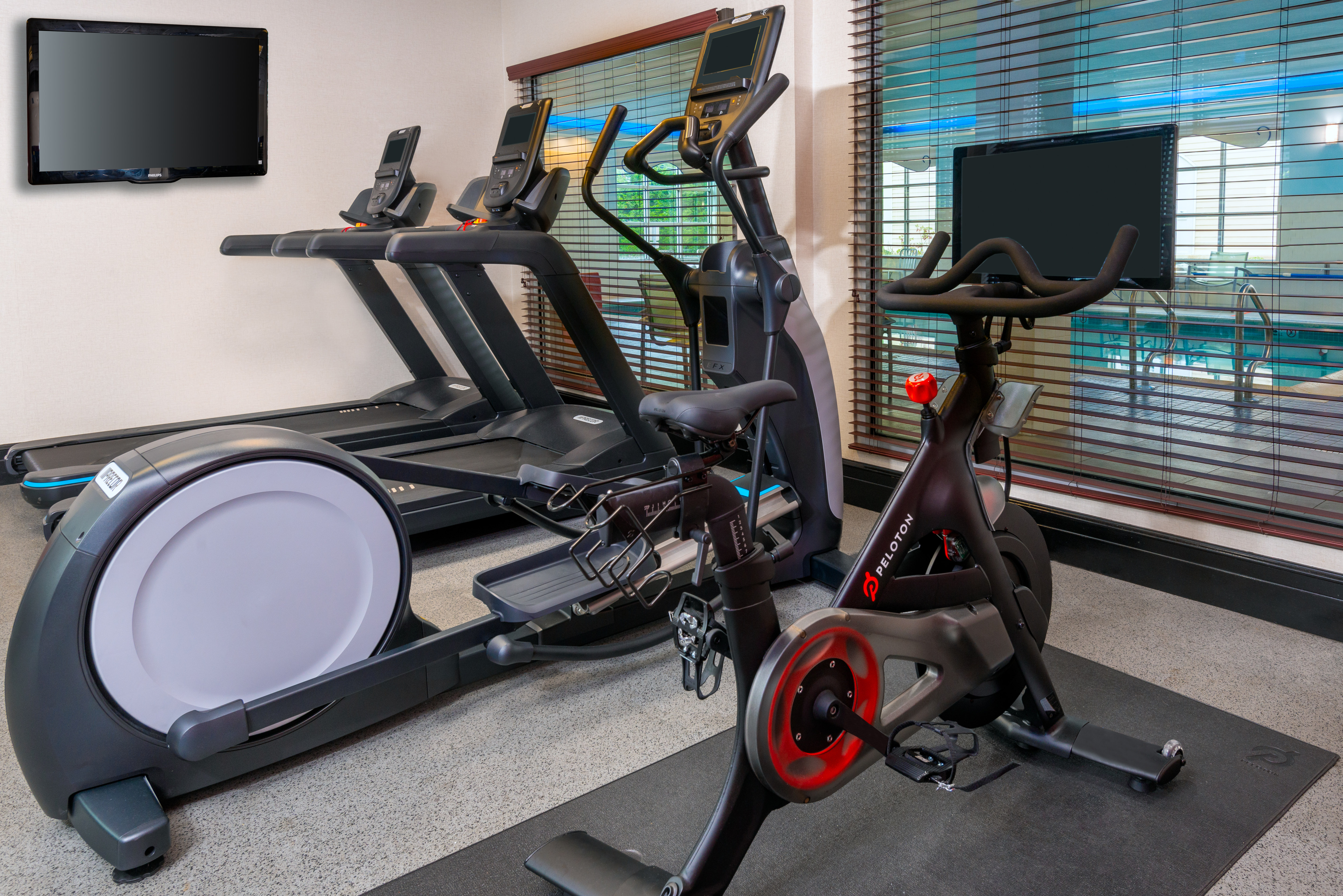 Fitness Center with  Modern Equipment and an HDTV