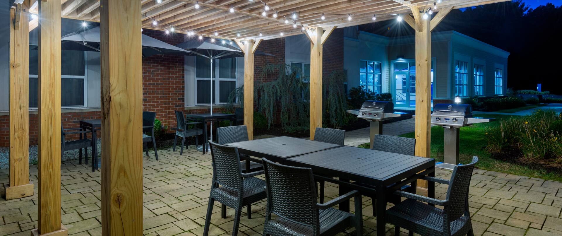 outdoor covered patio, bbq grills, tables and chairs
