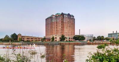 Hotel Exterior at daytime with view of river