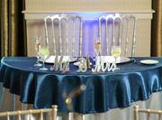 Wedding Table With Place Settings and "Mr. & Mrs" Decor on Blue Linens