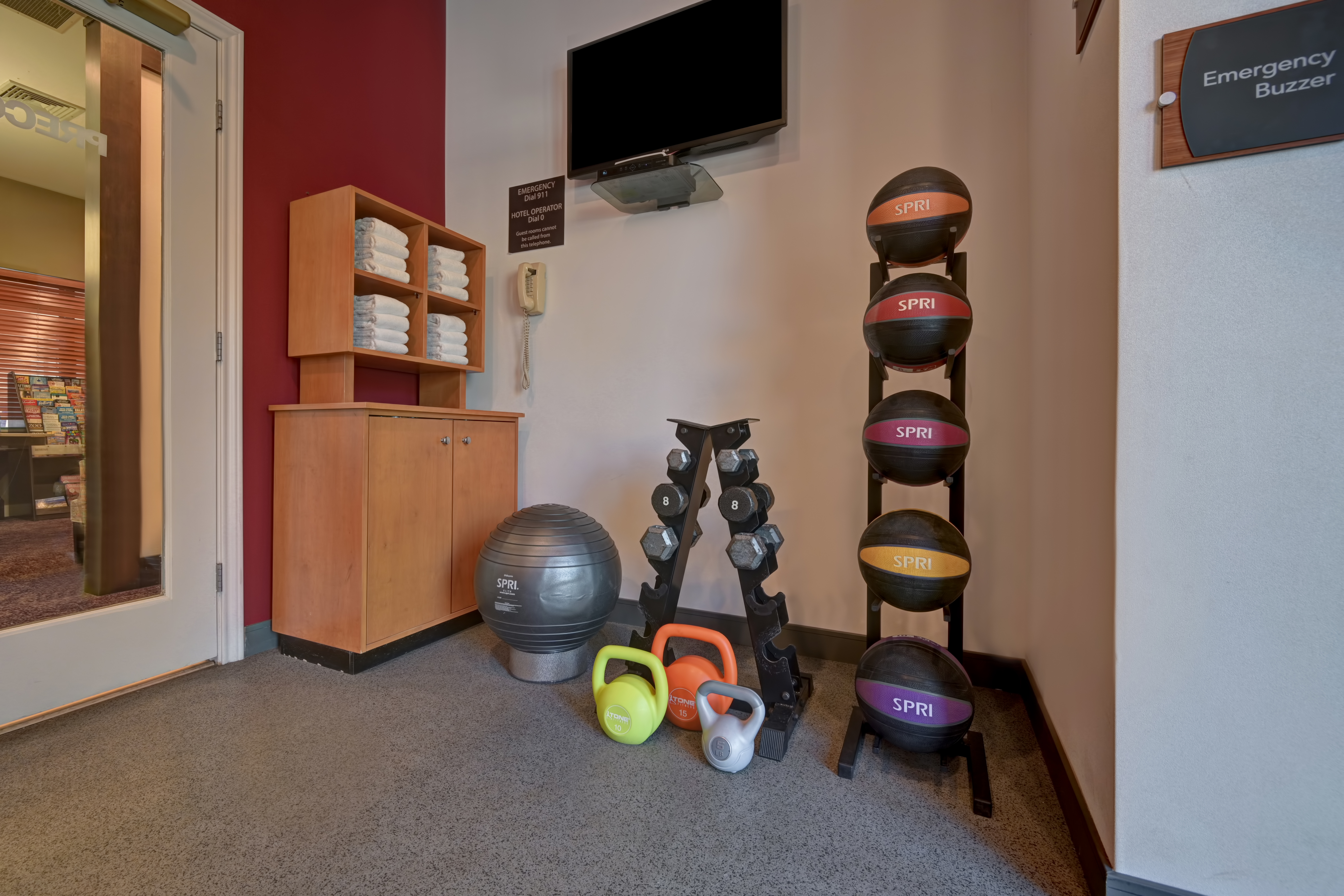 fitness center with weights and towels