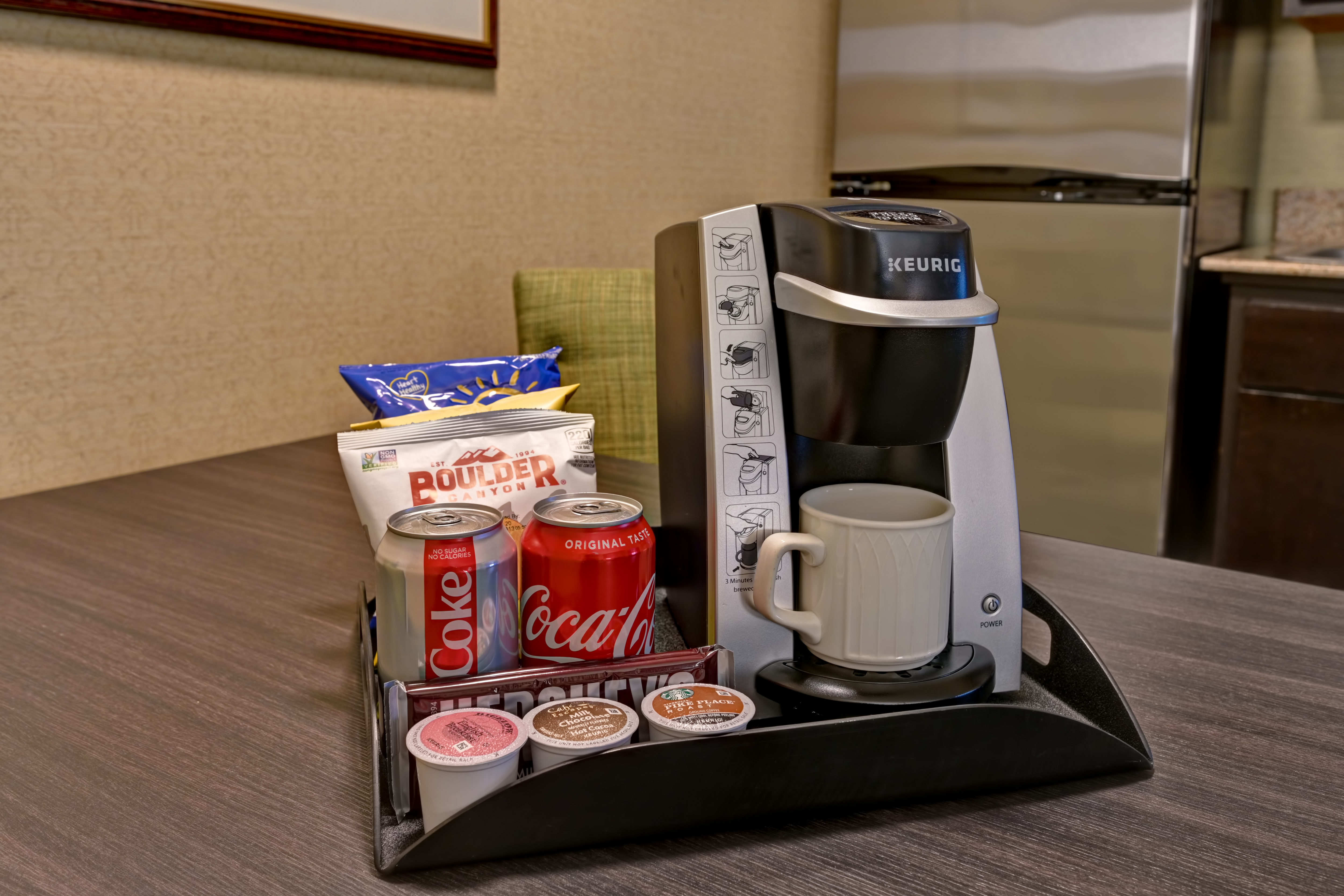 guest room with coffee machine drinks and snacks