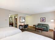 Two Queen Beds, Sofa, and Work Desk in Suite