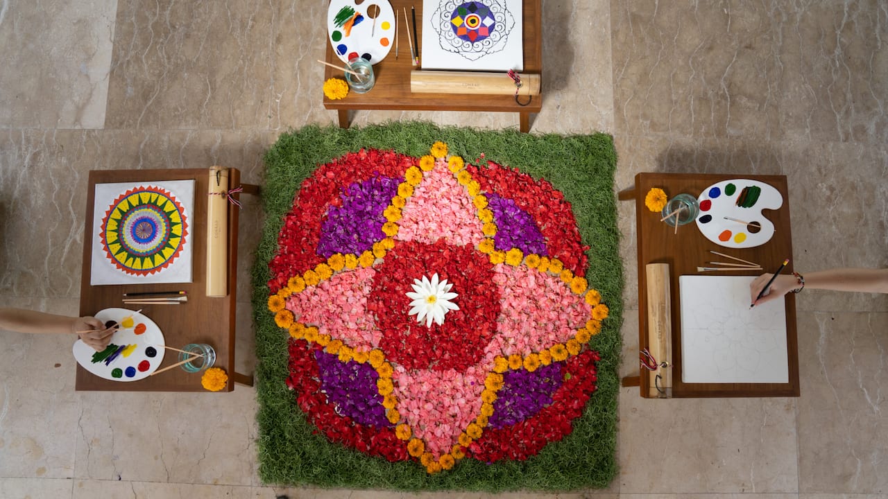 Display of paints and projects from an art therapy session.