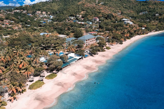 beach near property with trees