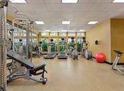 Convenient on-site fitness center featuring cardio and weight machines.