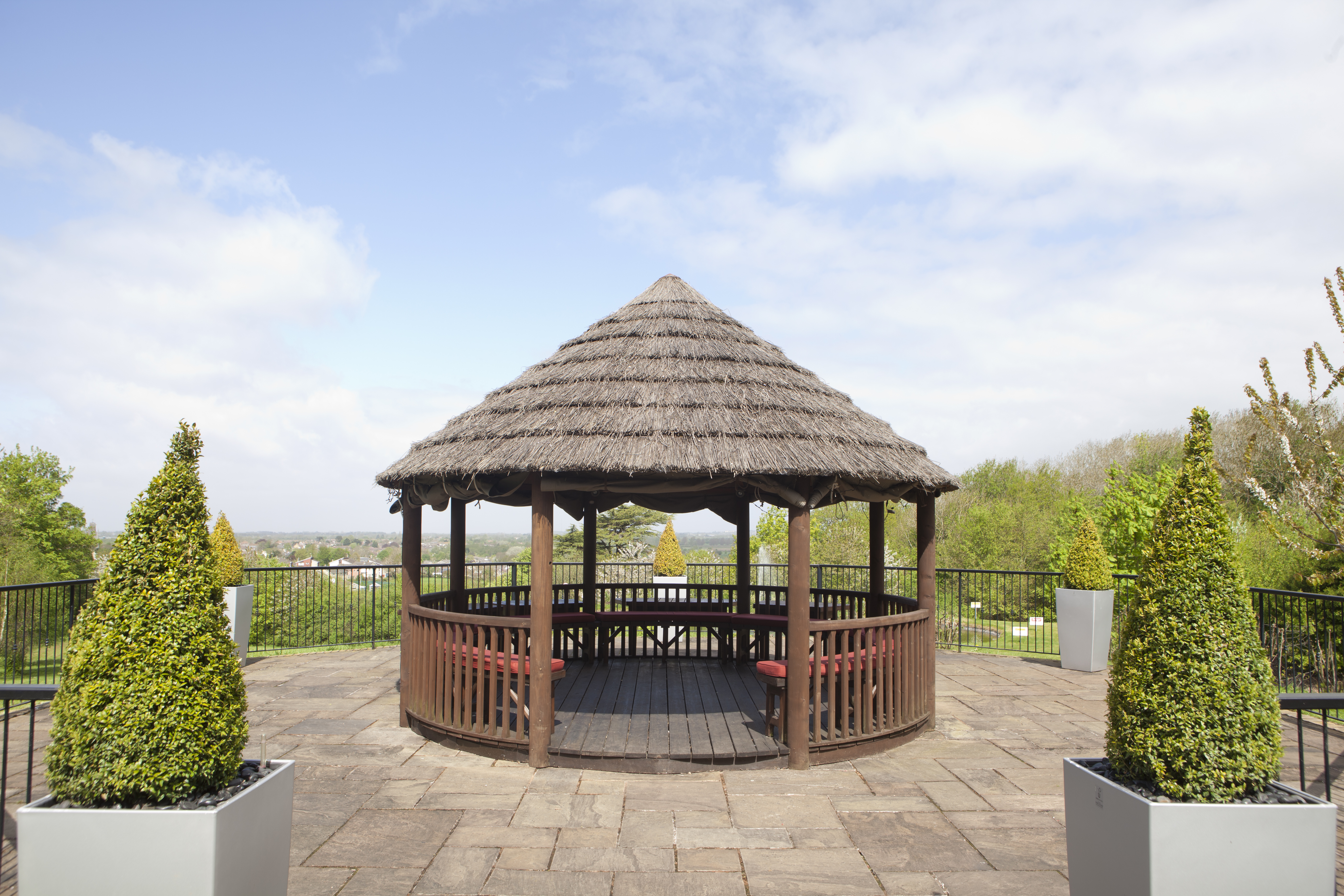 Detailed View of Seating Under Gazebo in Hotel Garden on a Sunny  Day