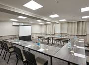 Avon Meeting Room With Seating for 12 at U-Table Facing Speaker's Table and Projector Screen