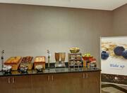 Breakfast bar with various food and drinks