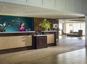 Lobby area with front desk agent