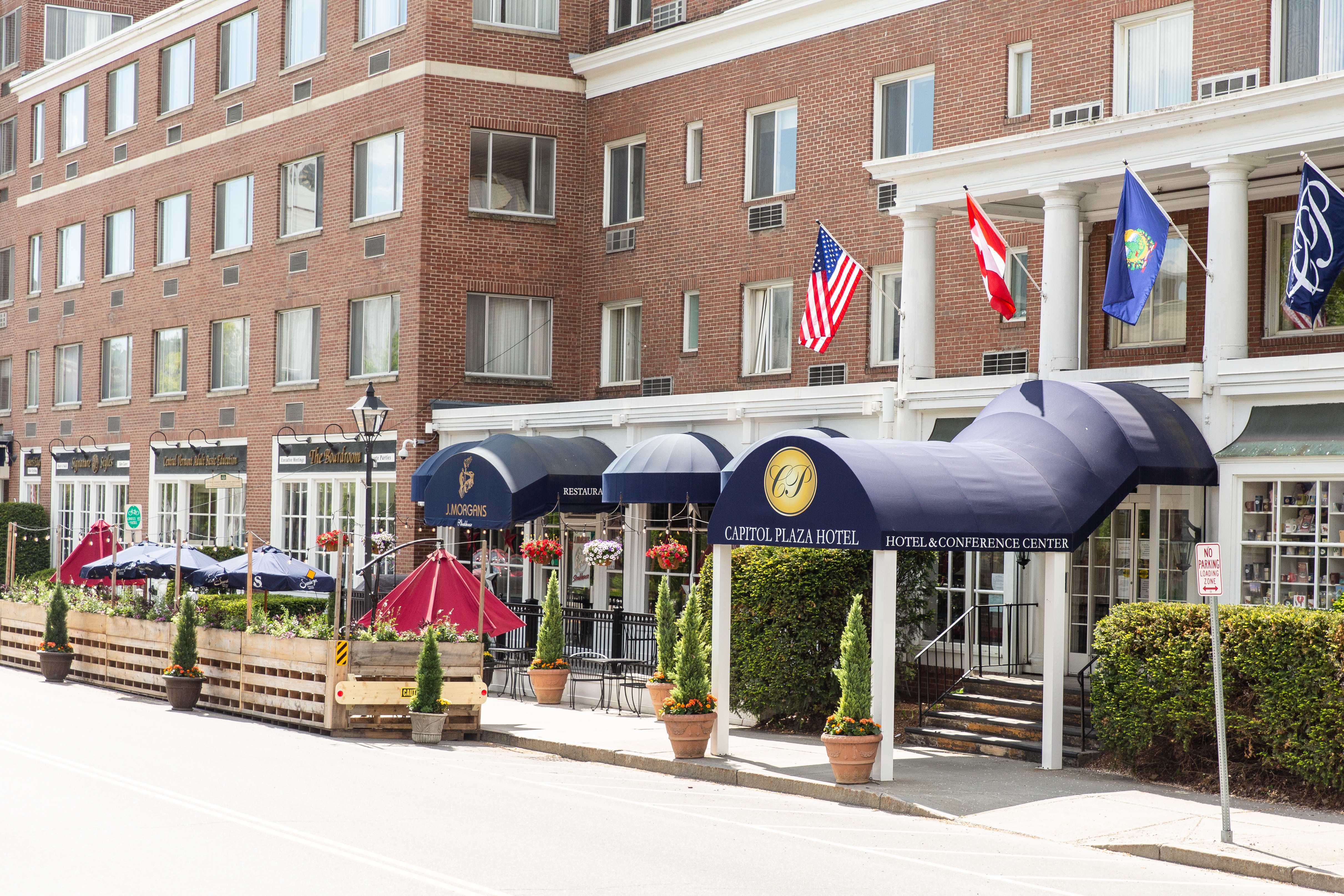 Hotel Covered Entrance and Flags Attached to Building