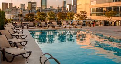 Outdoor Pool Area with City View