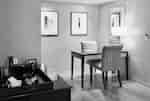 Table with two chairs and a mirror