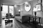 Lounge area of guest suite with couch and chair