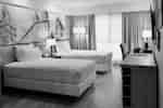 Two twin beds with nightstand between them