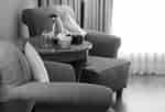 Two comfortable chairs with table between them