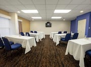 Meeting Room with Tables, Chairs, and Room Technology