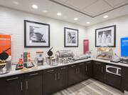 Dining Area with Waffle Irons, Pastries, Toast and Other Hot and Cold Food Options 