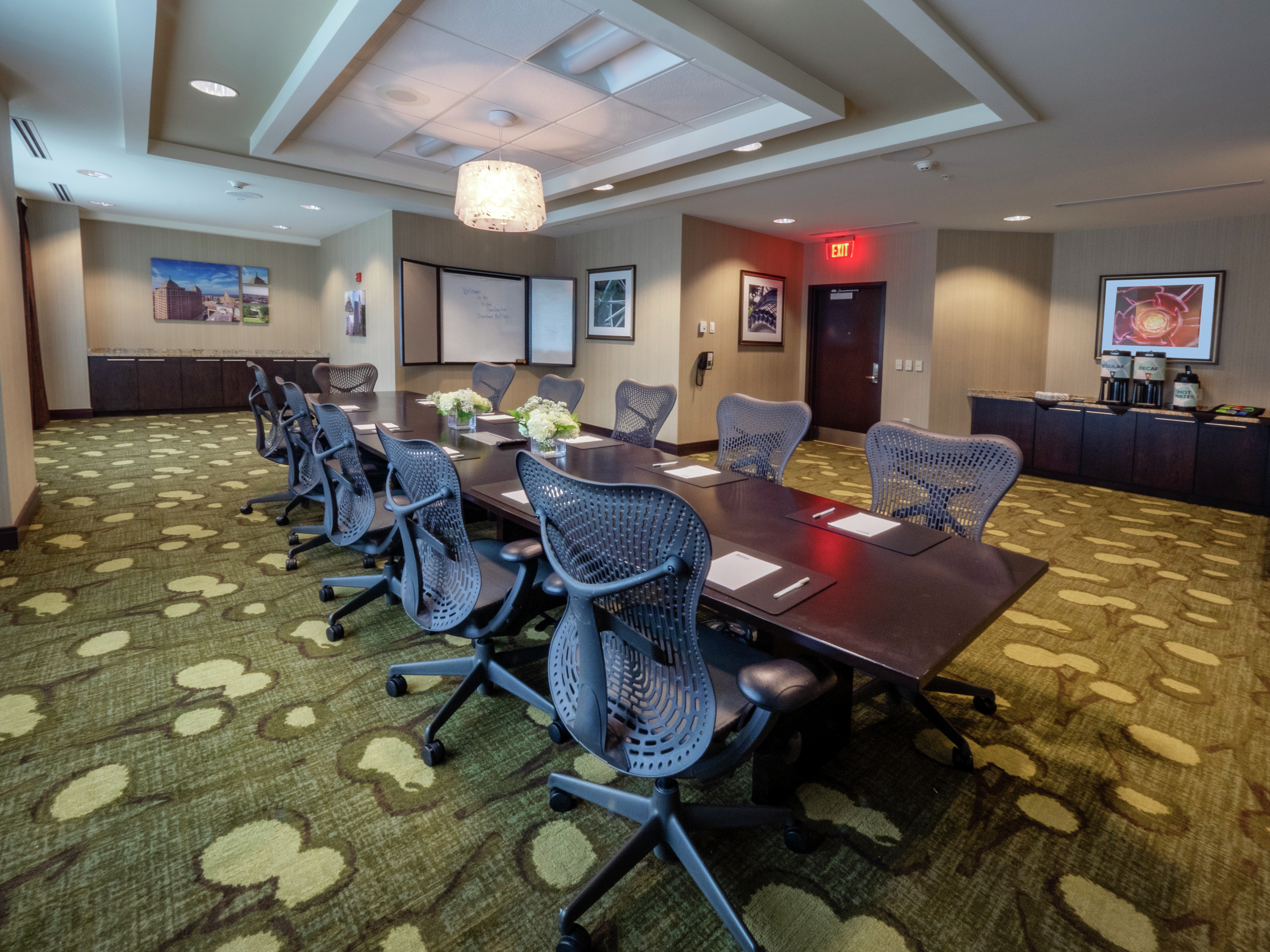 Side View of Meeting Room with Rectangular Table and Seats for 10 Guests