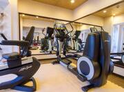  Fitness Center With Cardio Equipment and Mirrored Walls