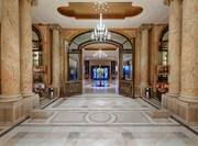 Lobby Area with Columns and Beautiful Chandelier