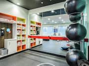 Fitness Center with Balls, Bar, and Mirror