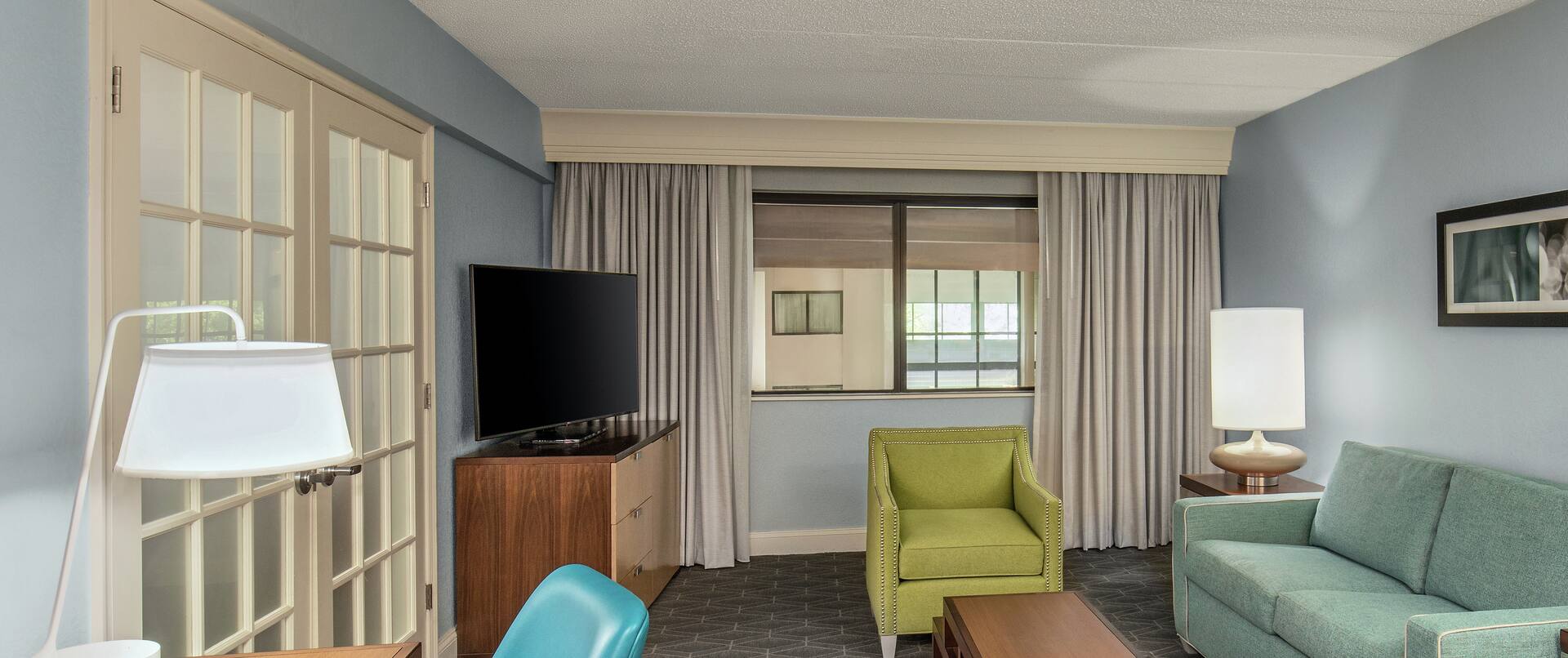 Relax on the Plush Couches within our Large Upscale Suites