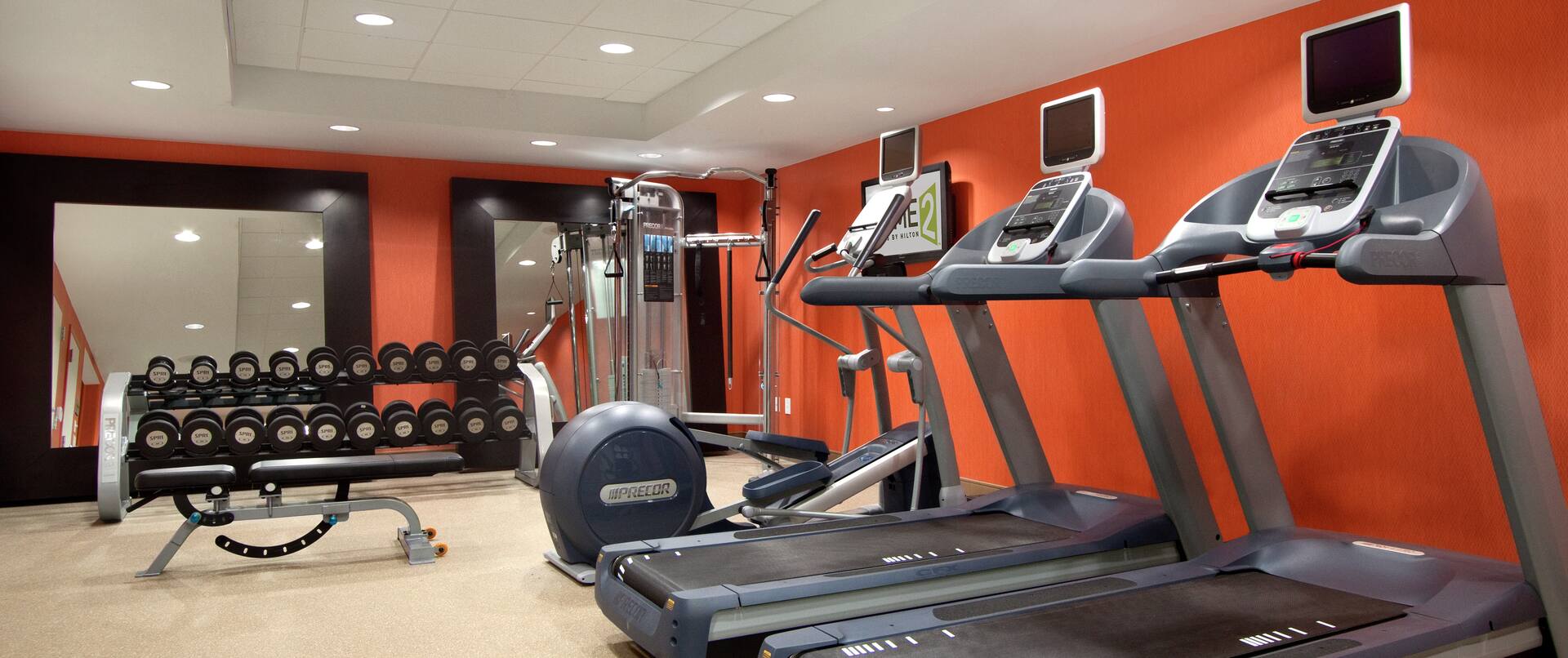 Free Weights, Bench, Weight MAchine, and Cardio Equipment in Spin2Cycle Fitness Area
