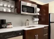Kitchenette With Full Sink And Microwave