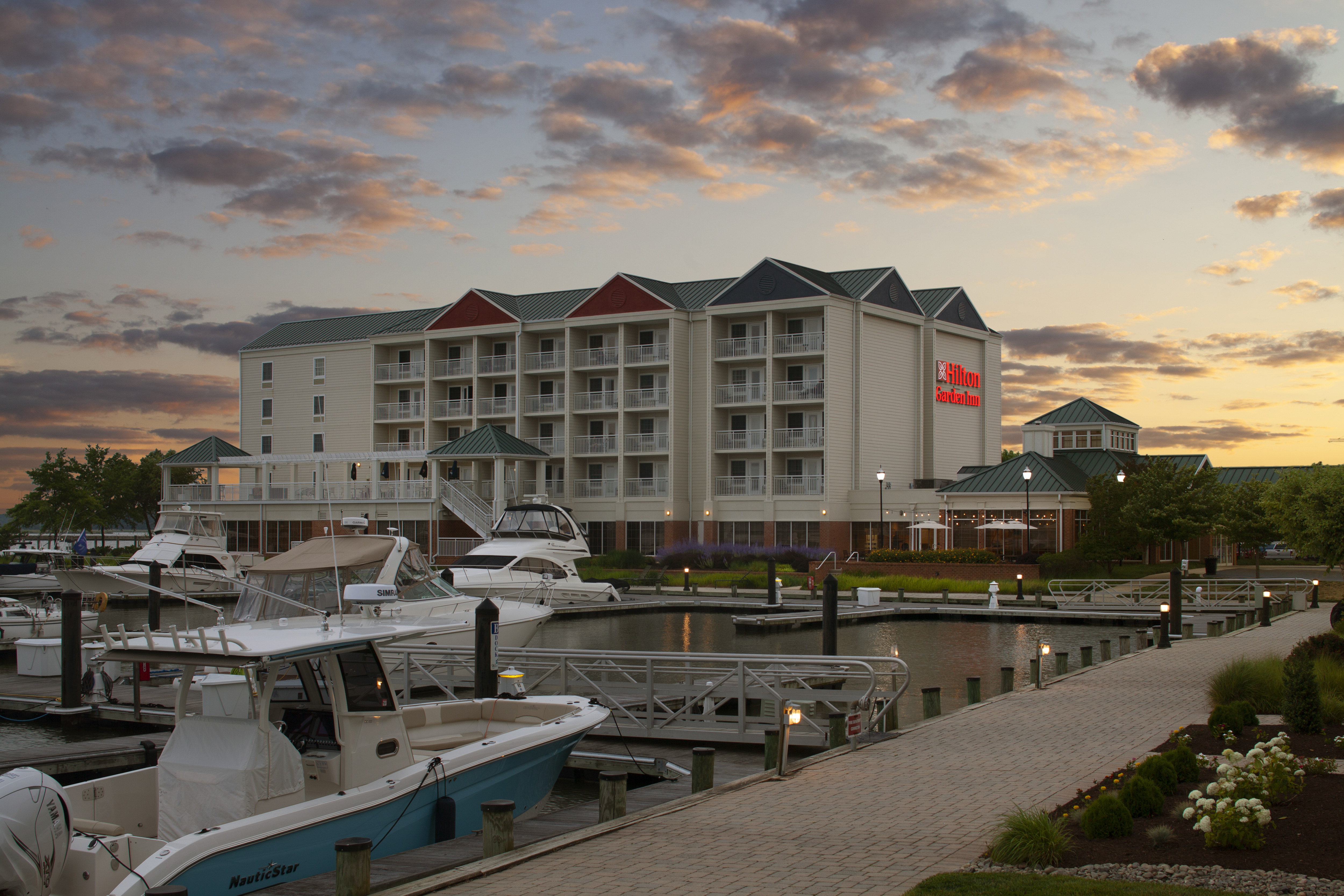 Hotel Exterior With Boat Dock
