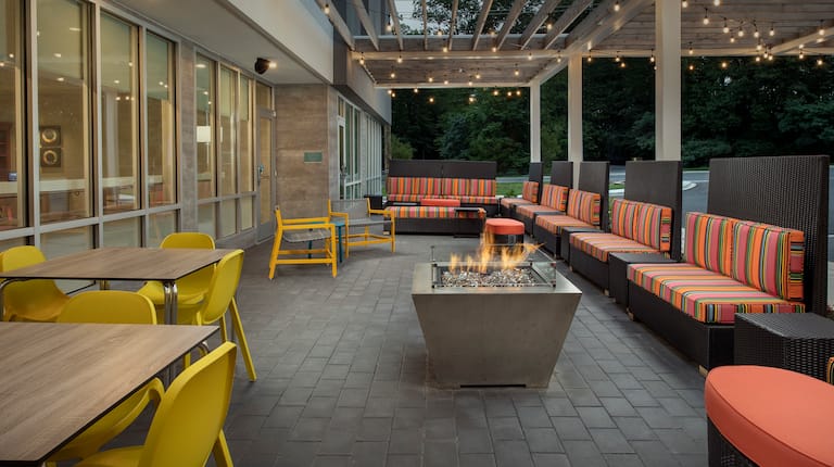 Outdoor Patio Area with Comfortable Seats around a Fire Pit