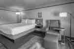 King-Sized Bed with Chair