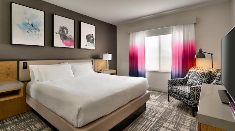 Bed in room with chair