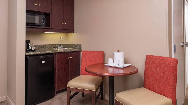 Wet Bar, and Seating for Two at Dining Table in Deluxe Room