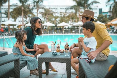 Family Having Ice Cream by the Outdoor Pool Area